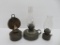Three miniature metal oil lamps, 5