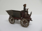 Cast iron dump wagon with crank and driver, 6