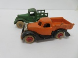 Two cast iron pick up trucks