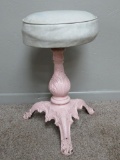 Cast iron base piano stool, upholstery top