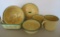 6 pieces of cream and green graniteware enamelware, cups, bowls, cover and strainer