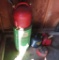 Assorted gasoline cans with contents and oil drum