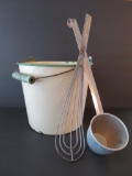 Cream and green enamelware bucket and metal dipper