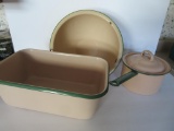 Three pieces of cream and green enamelware graniteware kettle and basins