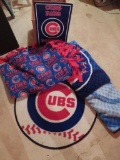 Chicago Cubs lot with rug, parking sign, and two blankets'throws
