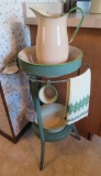 Green painted washstand with cream and green enamel pieces