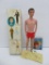 Flocked Hair Ken doll, pedestal and #750 Box and booklet