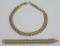 Gold tone necklace, braided with rhinestones
