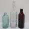 Three different style Grafs soda bottles