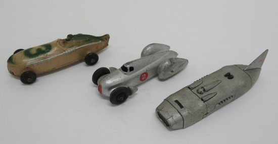 Three vintage race cars, metal and rubber