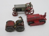 Three metal tractors and car, 2