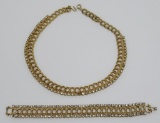 Gold tone necklace, braided with rhinestones