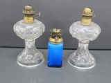 Three miniature oil lamps, 4