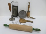 Vintage kitchen items, wooden masher and butter paddle, rolling pin, grater and strainer