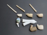 Five clay pipes and 2 porcelain pipe bowl, all parts as found
