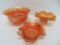 Three marigold carnival glass bowls