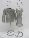 Mesh metal displays, mens jacket and woman's dress on stands, 22