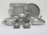 Seven pieces of vintage aluminum serving and table pieces