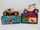 Two battery operated bump and go cars in boxes, need work, as found