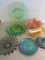 Six pieces of irredescent carnival style glassware and green depression cake plate