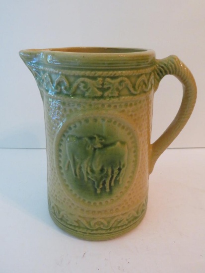 Yellow and Green stoneware milk pitcher, cows, 7 1/2"