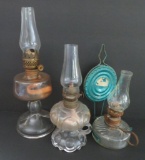 Three miniature oil lamps, 6