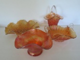 Four pieces of Marigold carnival glass