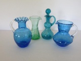 Four pieces of hand blown colored glass, pitchers and cruet, 4