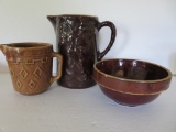 Three pieces of brown stoneware, Cherry pattern milk pitcher, cream pitcher and beater bowl