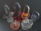 Six miniature glass baskets, colored and clear, 3