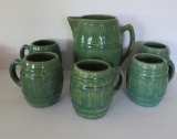 Green stoneware pitcher and five mugs