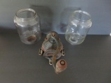 Two glass coffee grinder jars and one partial base