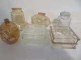 Four glass still banks, pigs, bell and glass blocks, 3