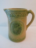 Yellow and Green stoneware milk pitcher, cows, 7 1/2