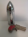 Paladin Henry Derringer cap gun and 42 Centimeter bullet still bank with WWI battle dates