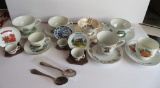 10 souvenir cup and saucers with two collector spoons