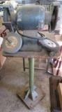 Bench grinder on metal stand. working