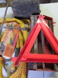 Automotive safety lot with emergency warning triangles, tow rope, and trailer chuck