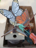 Yard decorations, hummingbird feeder and bird house