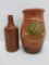 Redware decorated crock with handle and stoneware bottle