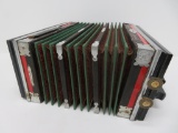 Universal Accordion, very ornate with inlay and celluloid portrait buttons