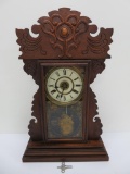 Nice carved mantle clock with scenic glass, with key and pendulum, 23