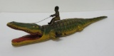 Tin litho wind up alligator with native rider toy, 15