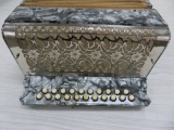 Grey pearilzed accordion, unmarked, button accordion, 11
