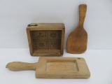 Wooden butter paddle, and two wooden butter molds