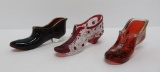 Three ruby glass shoe slippers, 5