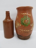 Redware decorated crock with handle and stoneware bottle