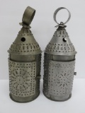 Two pierced metal candle lamps, 13