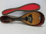 Butterfly inlay mandolin with case, damage noted, 25