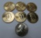 Seven US dollar coins, six presidential and one Susan B Anthony